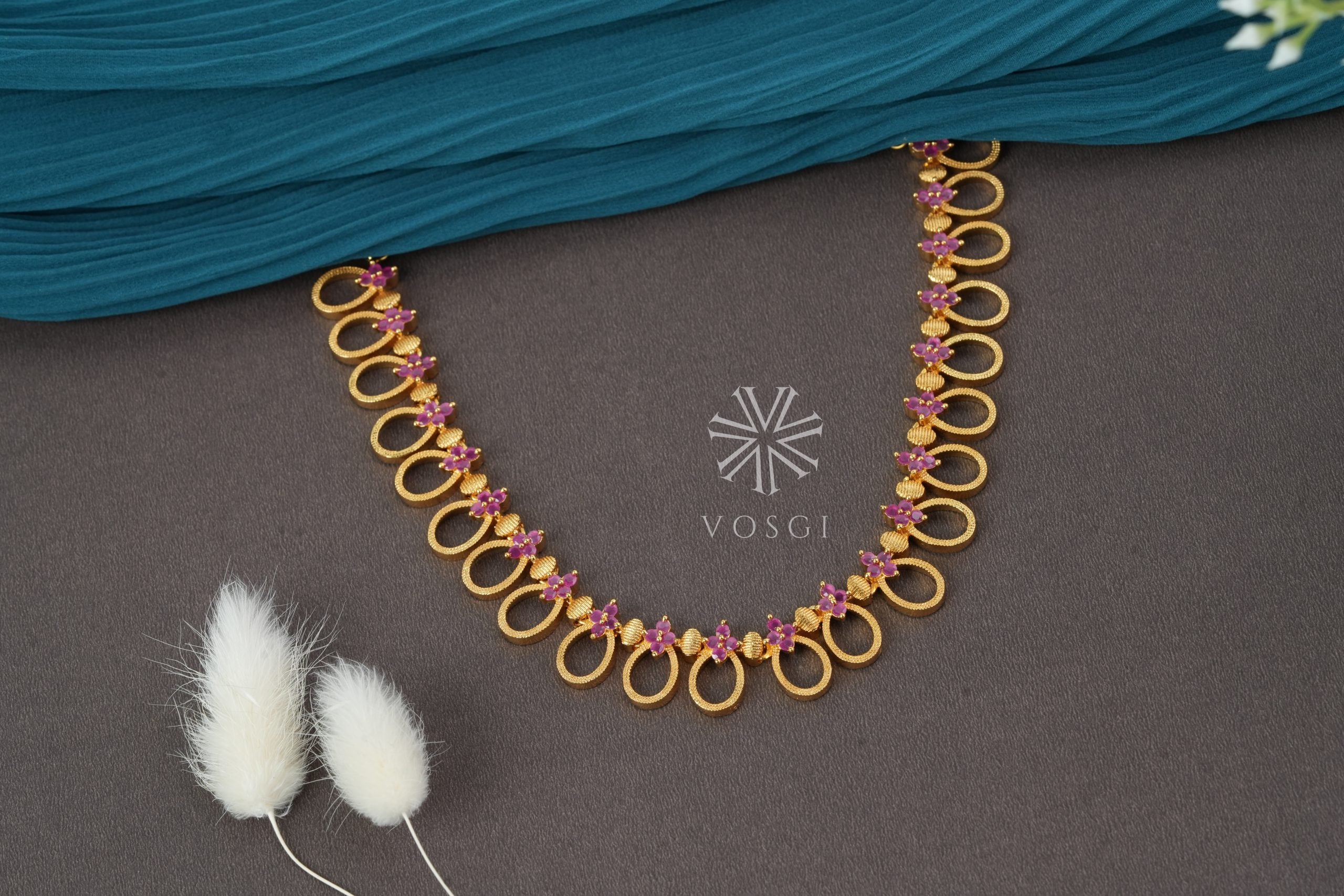 gold toned temple necklace