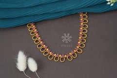 gold toned temple necklace