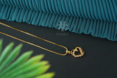 gold toned necklace with pendant